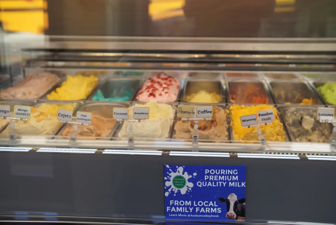 The ice cream case at Kykas Delights with the local family farms milk sign