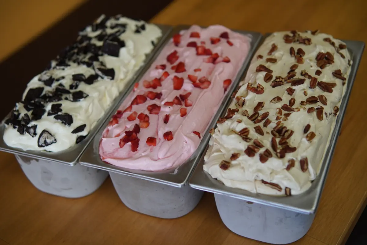 Three tubs of freshly made ice cream